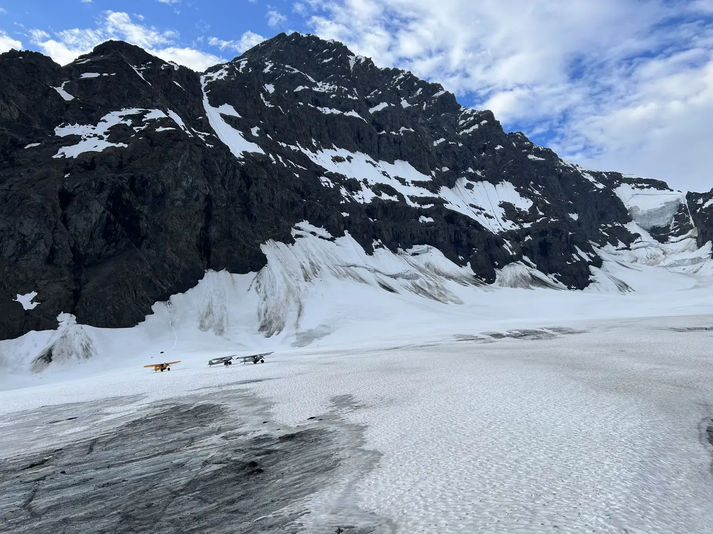 arctic restoration alaska planes in front of beautiful mountains